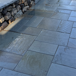 Dimensional Bluestone intalled on a patio designed by Nest Outdoors of Bedford NH