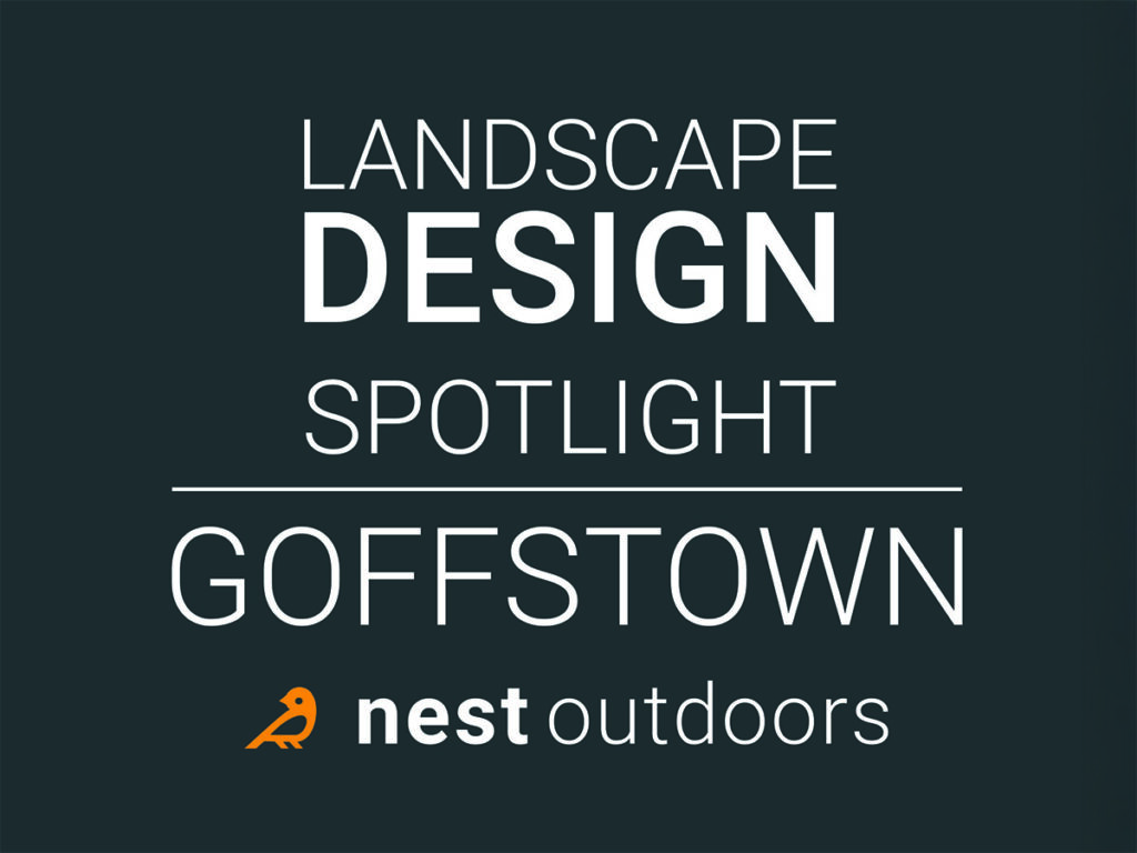 Landscape design in Goffstown NH includes a patio and stone walls by Nest Outdoors